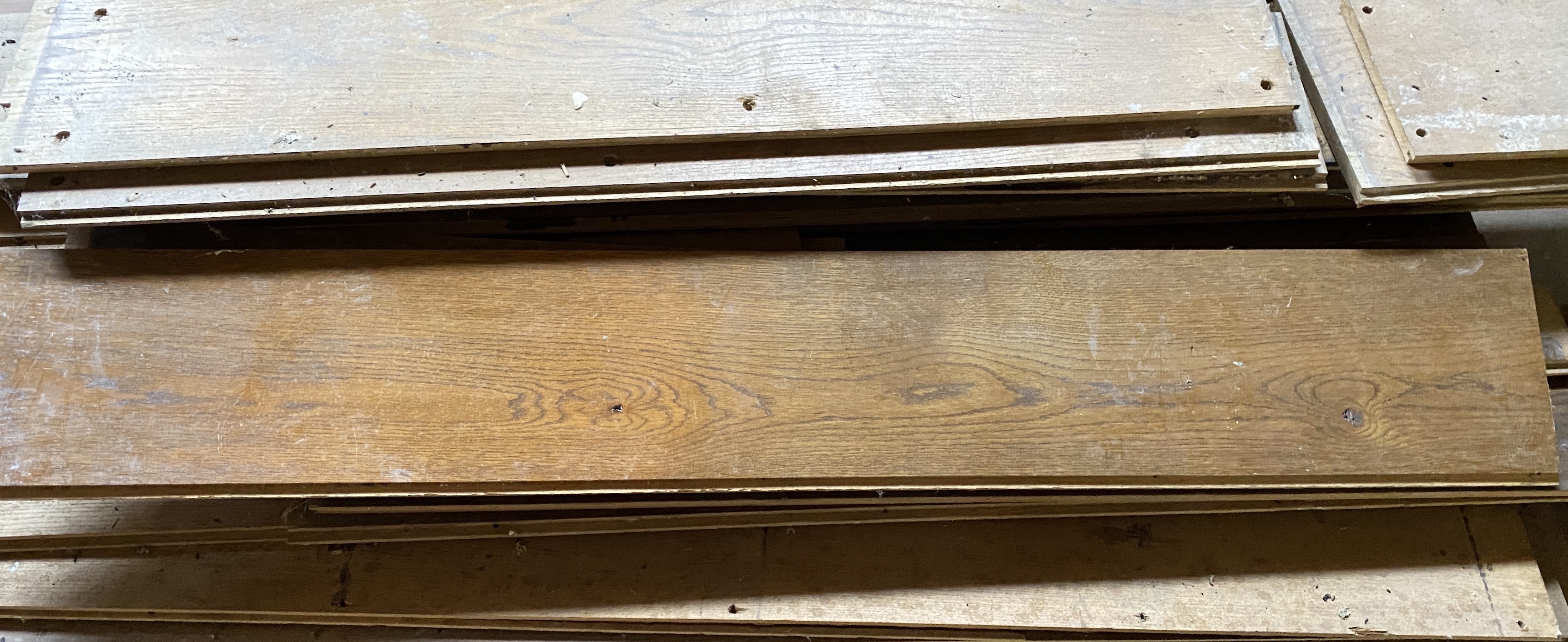 Solid oak floor boarding of various lengths, widths 25cm, 2cm thick, as previously fitted to a room 561 x 455cm (approx. 25.5sq. metres)